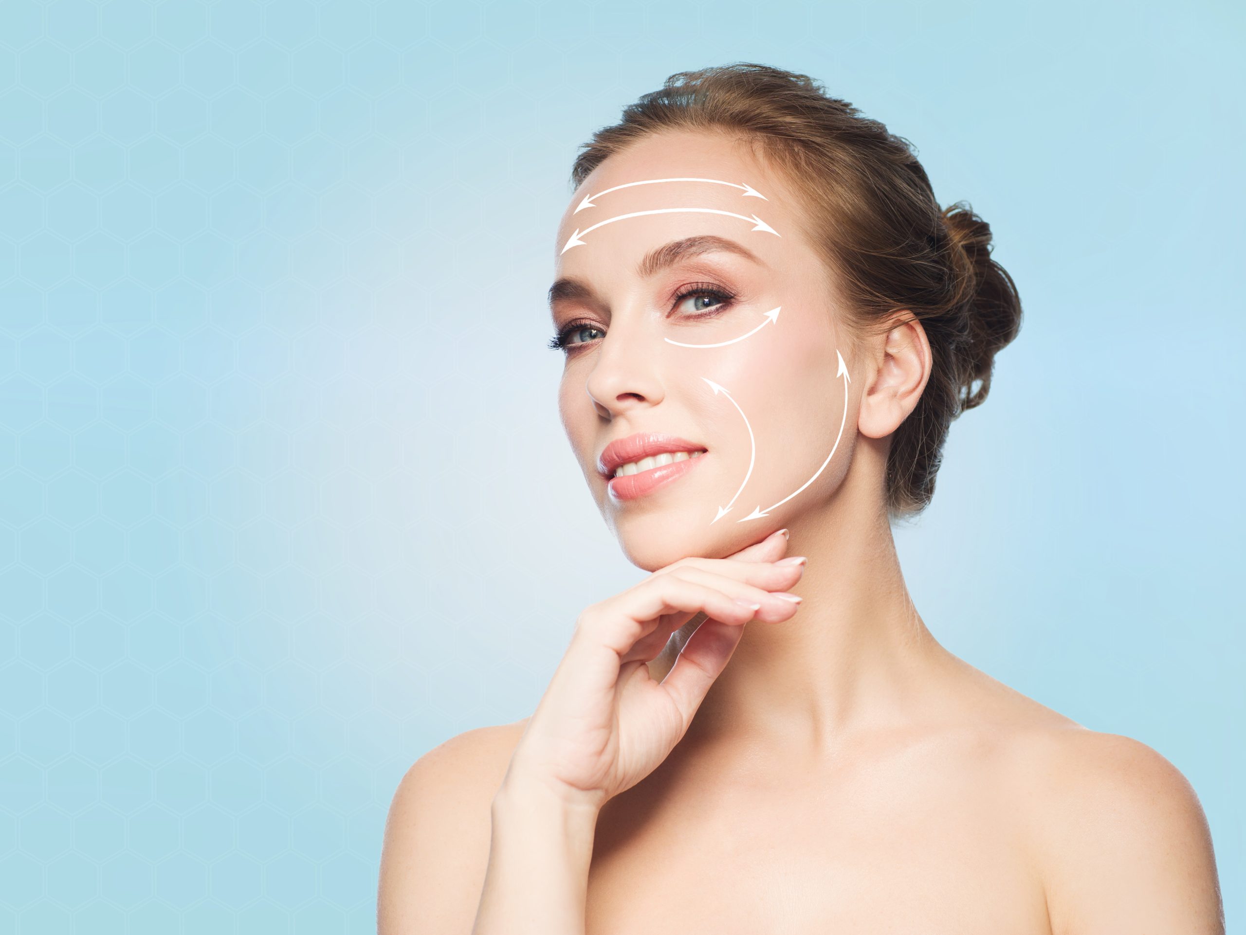 Woman with clear skin touching her jawline