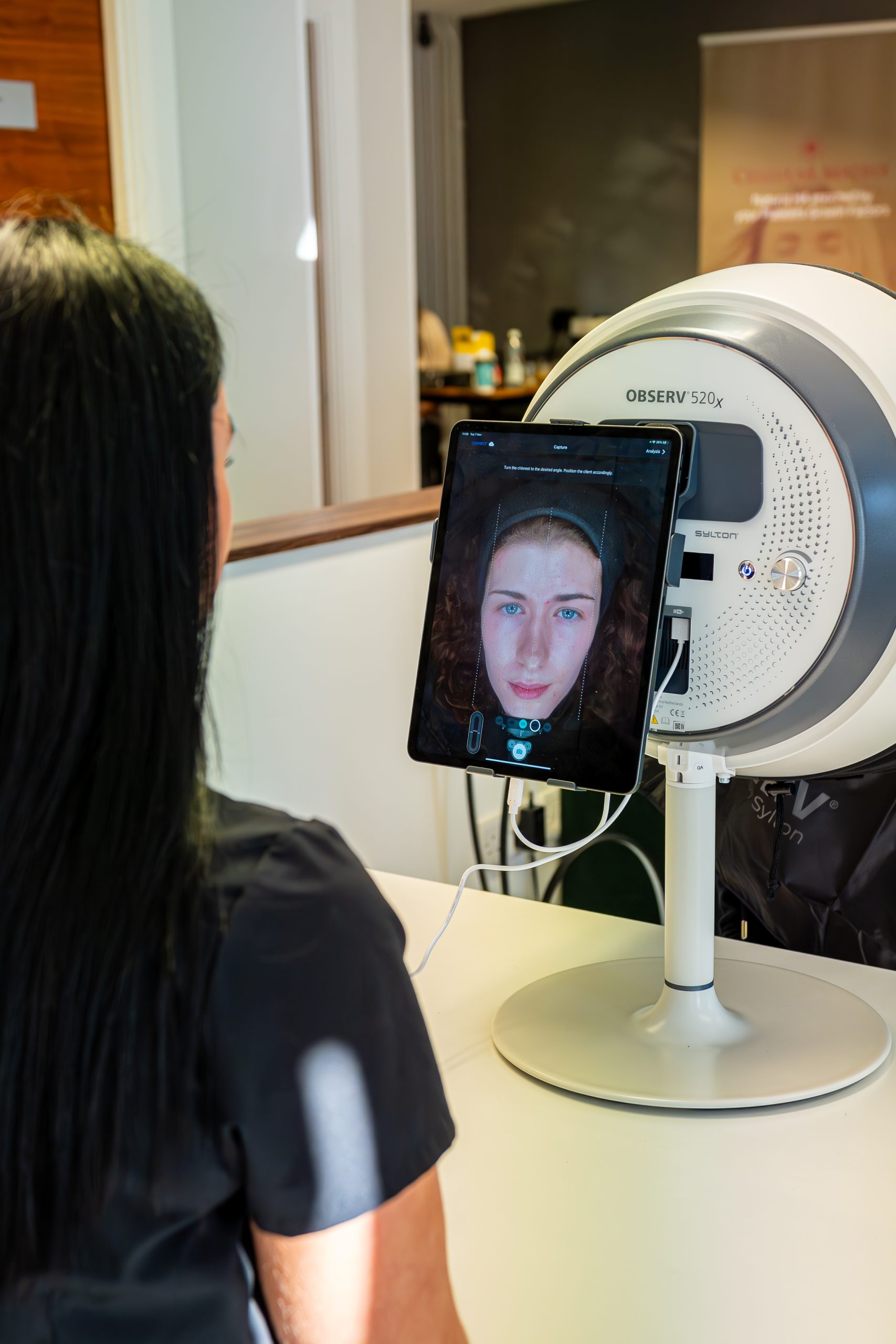 Patient having a skin analysis scan in clinic