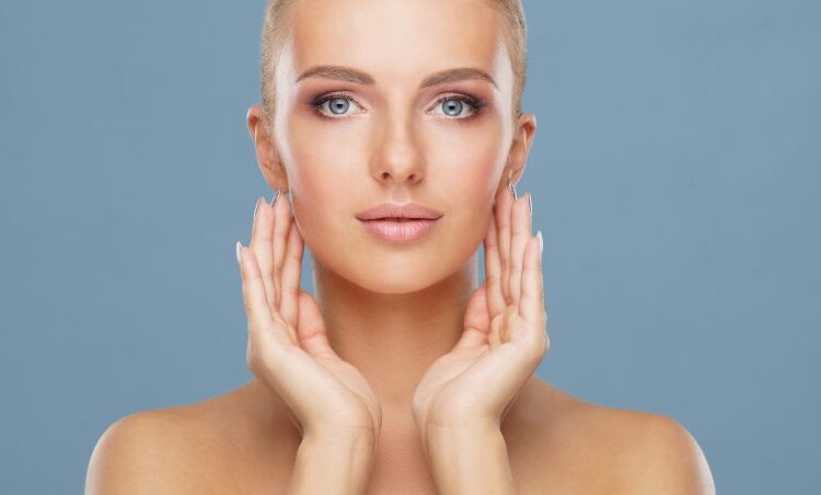 Woman framing her face with her hands