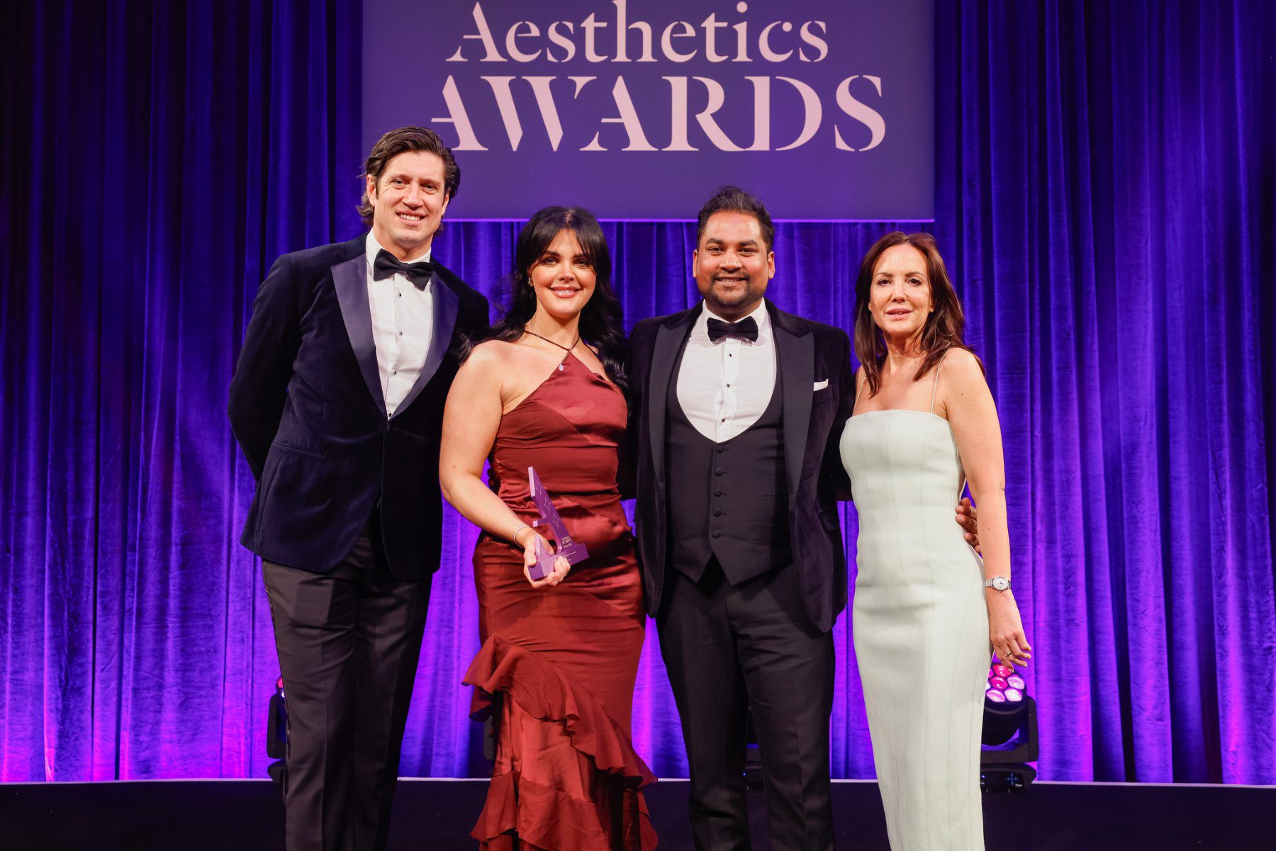 The A Aesthetics team on stage with their trophy at the Aesthetics Awards 2025